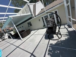 a chair sitting on a porch of a house at 5 Bedroom 4 Bathroom Pool Gym Leesburg Retreat in Leesburg