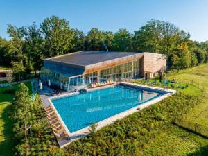 an overhead view of a building with a swimming pool at Stylish Retreat with Sauna in Antoing