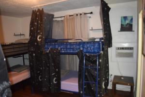 a room with two bunk beds in a room at Drip Star Life Hostel Miami 3 in Parkway Regional Medical Center Heliport +24 photos