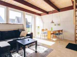 a living room with a couch and a table at Seaside Escape in Gedser - By Traum Ferienwohnungen in Gedser +42 photos