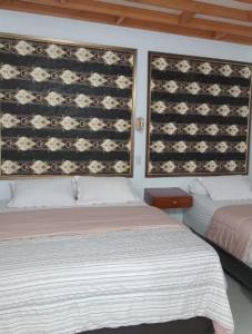 Postel nebo postele na pokoji v ubytování Casa Tripa Homestay