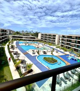 a view of a pool from a balcony of a hotel at Flat 400m da Praia de Muro Alto - 302C Malia Beach in Ipojuca