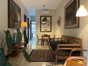a living room with a couch and a table at Mawartiga Homestay in Demangan