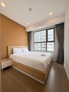 Ένα ή περισσότερα κρεβάτια σε δωμάτιο στο Life of Perfection Apartment