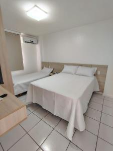 En eller flere senge i et værelse på Resort Grand solare residence + 18 billeder