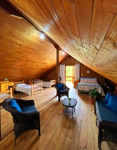 a large living room with a bed and a wooden ceiling at Recanto Paraíso da Colina in Santo Amaro da Imperatriz +88 photos