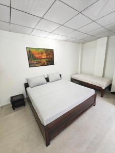 Ένα ή περισσότερα κρεβάτια σε δωμάτιο στο Home like Stay