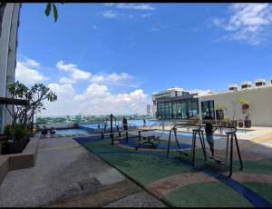 a playground in a building with people playing in the water at Suria jaya studio condo shah alam in Shah Alam