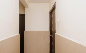 an open door in a room with white walls at Hotel O Diplomat in Sopāra
