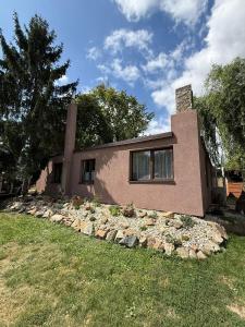 a house with a pile of rocks in front of it at Chata Bruno v Kutné Hoře in Kutná Hora