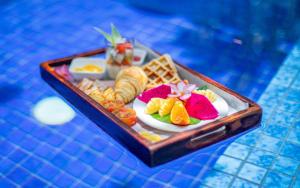 a tray of food is sitting on a table at Amber Angkor Villa Hotel & Spa in Siem Reap