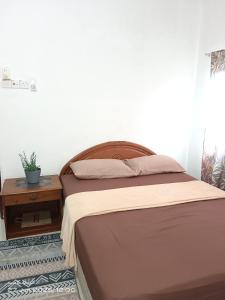 En eller flere senge i et værelse på EMBUN 2 LANGKAWI HOMESTAY