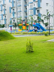 a park with a playground with a play equipment at Santorini Blue Sapphire - Luxury 3BR Theme Park Resort Apartment - Negombo in Negombo