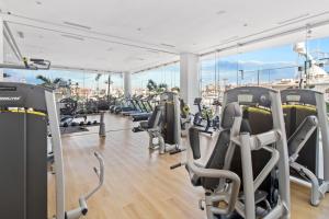 a gym with treadmills and elliptical machines at Marina Vallarta with View and Pool in Puerto Vallarta