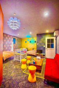 a childrens room with a crib and a bedroom at Villa Inuyama - Vacation STAY 87603v in Inuyama