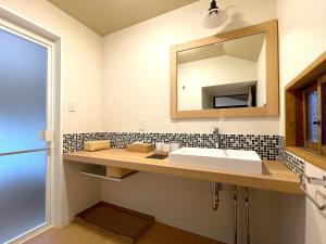 a bathroom with a sink and a mirror at Asuka no yado - Vacation STAY 14132 in Asuka +23 photos