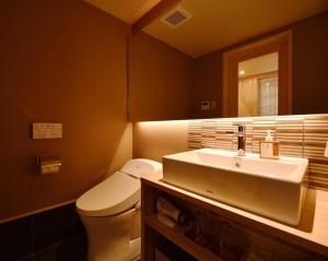 a bathroom with a white toilet and a sink at Kyoyado Heianshiki - Vacation STAY 00358v in Kyoto