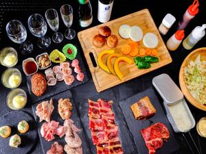 a table with a bunch of different types of food at Mt,Fuji Glamping Terrace Minenohana - Vacation STAY 35712v in Oishi +13 photos