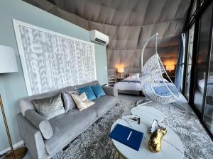 a living room with a couch and a bed at Mt,Fuji Glamping Terrace Minenohana - Vacation STAY 35071v in Oishi