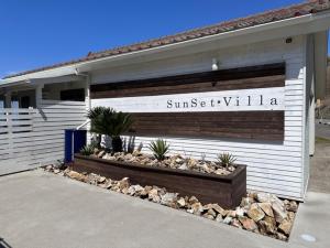 a building with a sign on the side of it at SunSet Villa - Vacation STAY 27888v in Nagaoka +3 photos