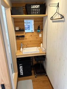 a bathroom with a sink in a tiny house at SunSet Villa - Vacation STAY 27888v in Nagaoka