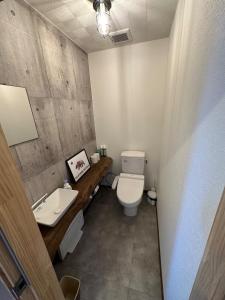 a bathroom with a toilet and a sink at SunSet Villa - Vacation STAY 52994v in Nagaoka
