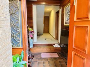 a hallway of a house with a door leading into a room at Fukuinn - Vacation STAY 35094v in Takamatsu +1 photo