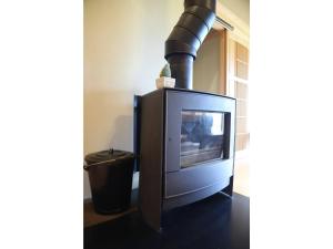 a television sitting in a room with a pipe at Villa MITORE-YA - Vacation STAY 13536 in Takayama