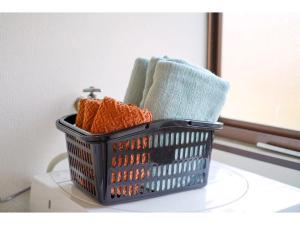 a laundry basket sitting on a counter with towels at Second House Nikko - Vacation STAY 13408 in Nikko +24 photos