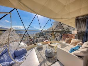 a living room with a large glass wall at Mt,Fuji Glamping Terrace Minenohana - Vacation STAY 35711v in Oishi