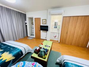 a hotel room with two beds and a table at FUKUINN - Vacation STAY 34537v in Takamatsu