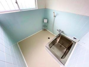 a small bathroom with a sink in the corner at Onomichi - House - Vacation STAY 13636 in Onomichi +31 photos