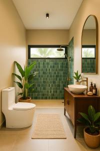 a bathroom with a toilet and a sink and a shower at KUUL Villas in Baan Tai