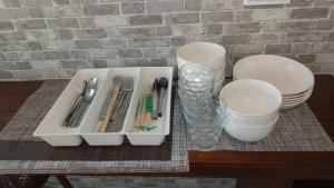 a table with a tray with utensils and a glass at Eight Beat Building - Vacation STAY 44869v in Tokyo