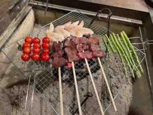 a bunch of meat and vegetables on a grill at Suian - Vacation STAY 55562v in Higashi-shibuta