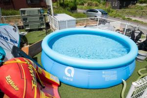 a large pool of water with a shopping cart next to it at Private Villa 405 - Vacation STAY 66258v in Shushi