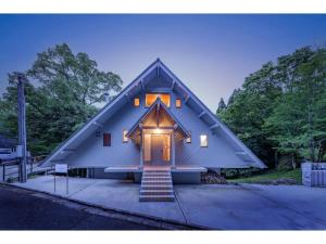 a house with a gambrel roof with a door at BOOKMARQ yufuin - Vacation STAY 13695 in Yufuin