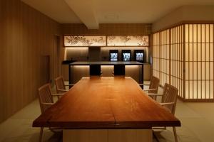 a conference room with a large wooden table and chairs at Aizuwakamatsu - House - Vacation STAY 94546v in Aizuwakamatsu