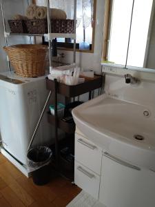 a kitchen with a white sink and a counter at Kagawagun - House - Vacation STAY 01716v in Naoshima
