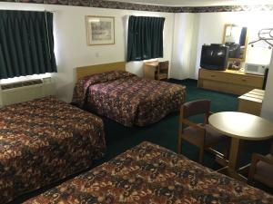 Postel nebo postele na pokoji v ubytování Motel 9