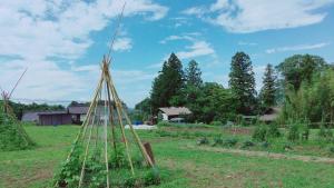 a garden with a framework of plants in a field at Satoyama villa DEN - Vacation STAY 17844 in Matsumoto