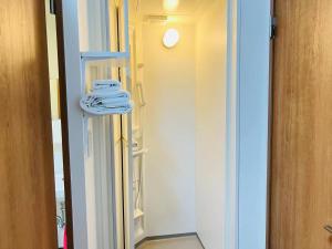 a room with a closet with towels on a shelf at FUKUINN - Vacation STAY 19203v in Takamatsu