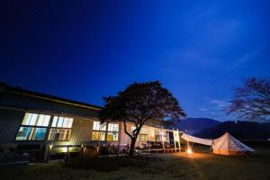a tent in front of a building at night at Nagatanchi - Vacation STAY 19913v in Mimata +12 photos