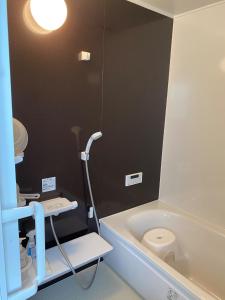 a bathroom with a bath tub and a toilet at Nagatanchi - Vacation STAY 19913v in Mimata