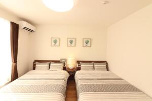 Postel nebo postele na pokoji v ubytování Grandmer Oyakawa - Vacation STAY 18394v