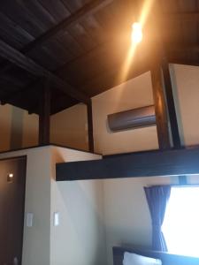 a room with a ceiling with a light on it at Amami - House - Vacation STAY 35269v in Amami