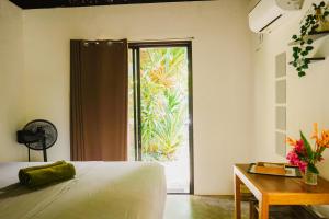 Postel nebo postele na pokoji v ubytování Yay Lodge SIARGAO, private room 1 with AC & hot shower and fast Starlink Wifi