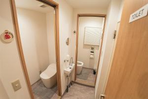 a small bathroom with a toilet and a sink at Business Hotel Kankokukan - Vacation STAY 45949v in Tokyo
