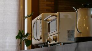 two toasters sitting on top of a counter at women only ulala guesthouse - Vacation STAY 44819v in Hagi +9 photos