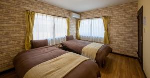 Postel nebo postele na pokoji v ubytování VILLENT Kujukuri Marine - Vacation STAY 44476v